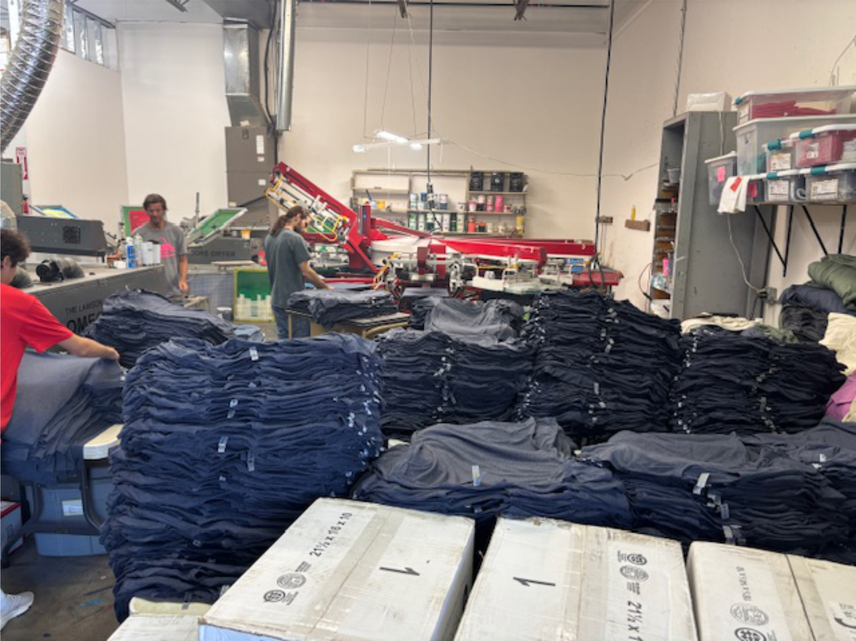 Stack of folded custom t-shirts for a group order